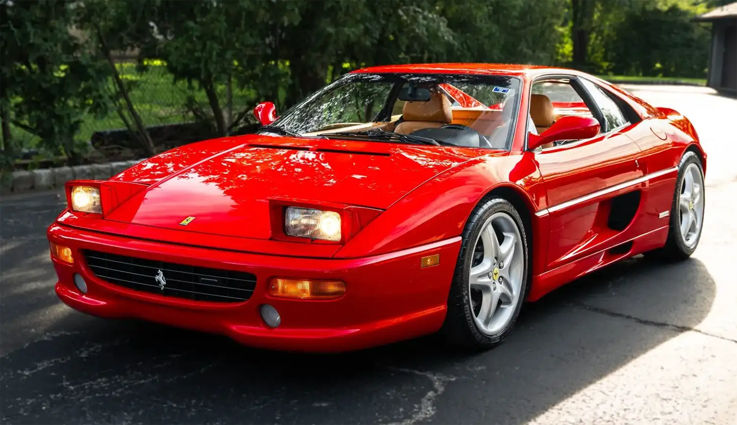 Red Ferrari F355 Berlinetta, front three-quarter view